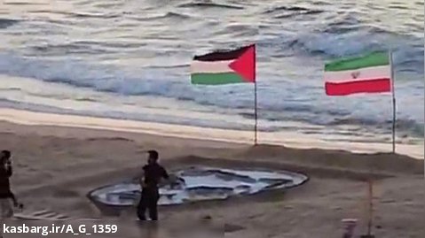 ترسیم چهره سردار سلیمانی با شن در سواحل غزه